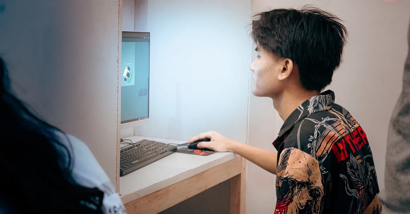 An ECC Computer Training Centre student working at a monitor during class